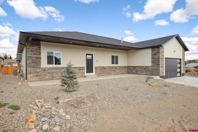 view of front of property featuring central air condition unit and a patio area