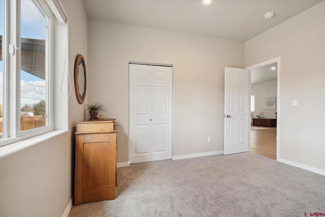 carpeted bedroom with a closet