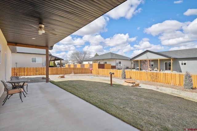 exterior space featuring ceiling fan