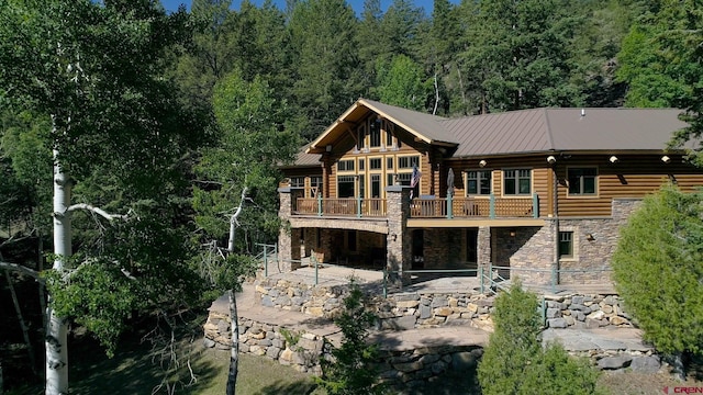 rear view of property featuring a patio