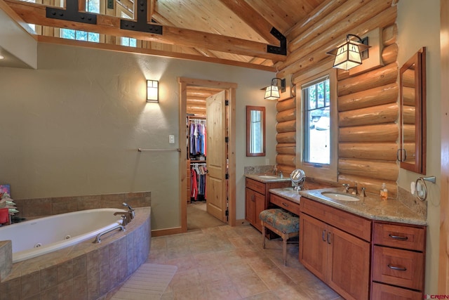 bathroom featuring vanity with extensive cabinet space, tiled tub, tile floors, wooden ceiling, and rustic walls