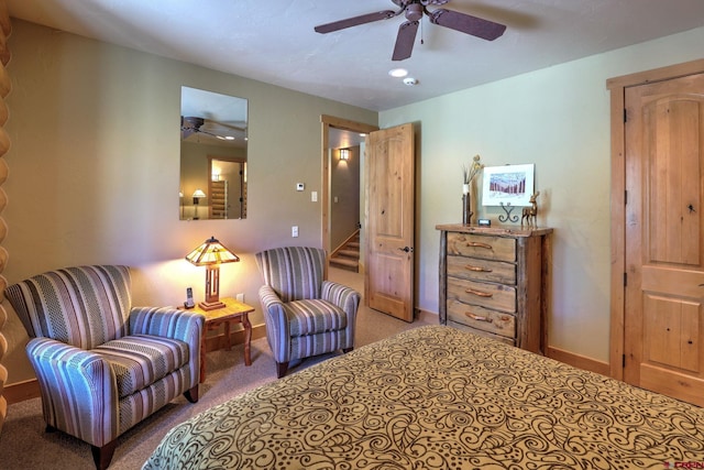 bedroom with ceiling fan and carpet floors