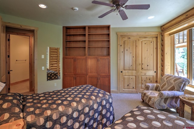 carpeted bedroom featuring ceiling fan