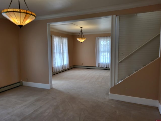 unfurnished room featuring crown molding, light colored carpet, and a wealth of natural light