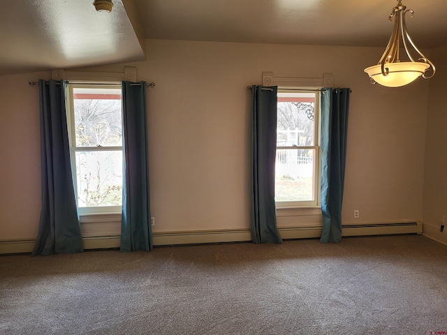 carpeted empty room featuring plenty of natural light and lofted ceiling