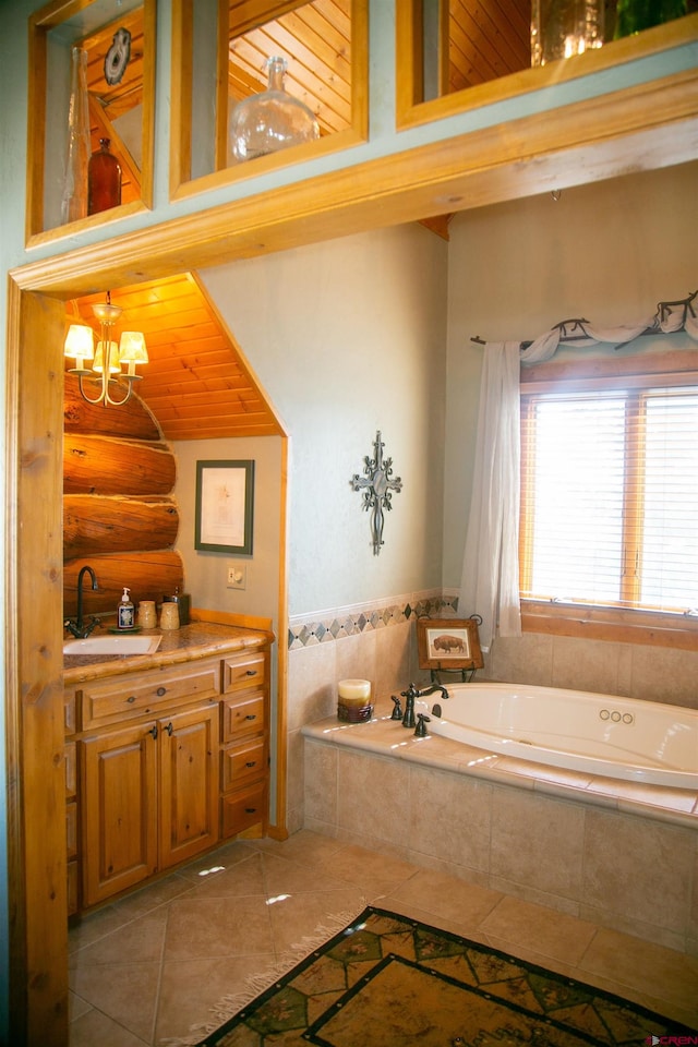 bathroom featuring a chandelier, tiled bath, tile floors, vanity, and lofted ceiling