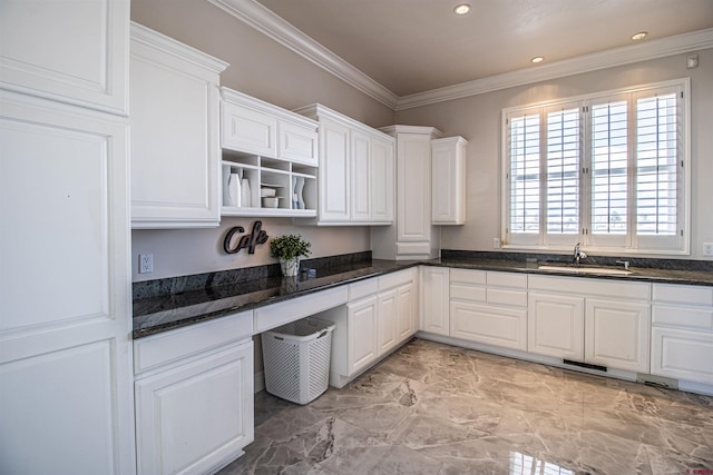 kitchen featuring sink, dark stone countertops, light tile floors, and white cabinets