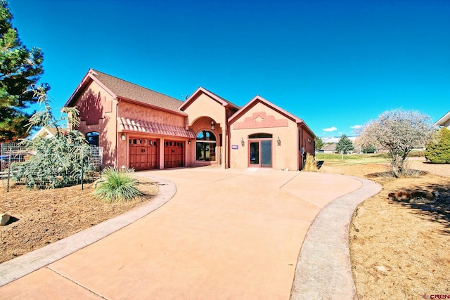 view of front of property featuring a garage