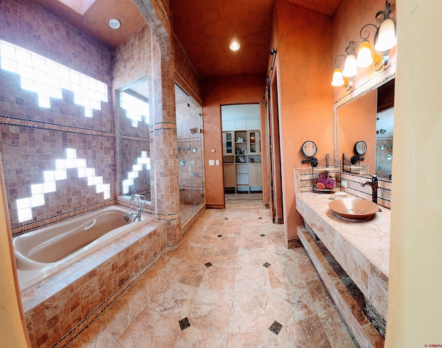 bathroom with shower with separate bathtub, vanity, and tile flooring