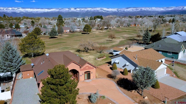 birds eye view of property with a mountain view