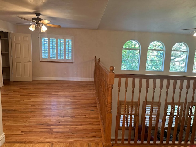 interior space featuring ceiling fan and light wood-type flooring