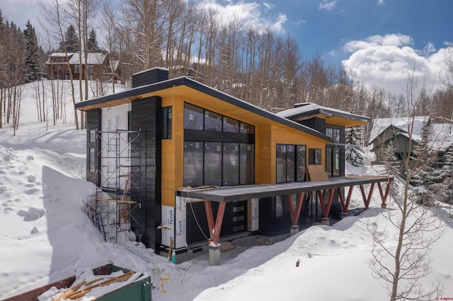 view of snow covered house