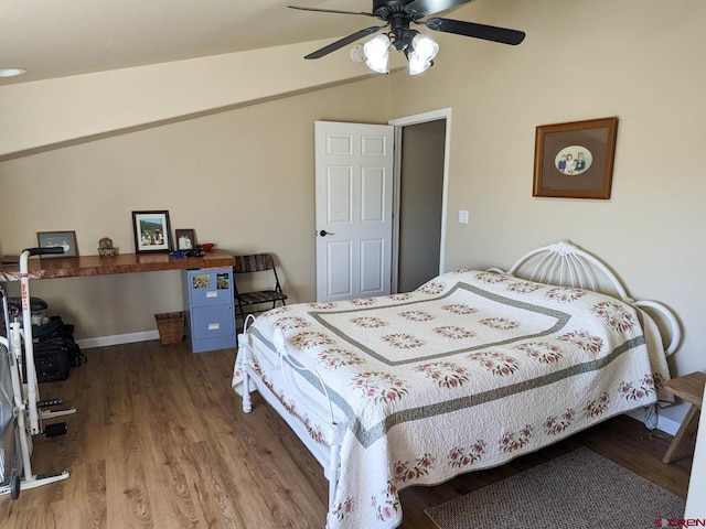 bedroom with lofted ceiling, ceiling fan, and hardwood / wood-style flooring