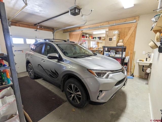 garage featuring a garage door opener and a workshop area