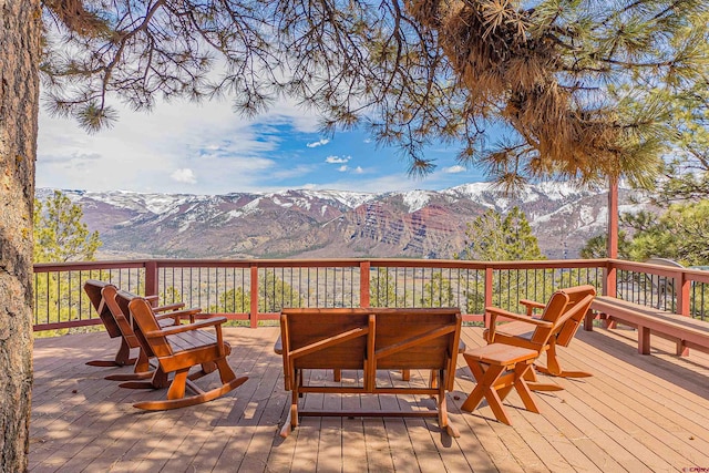 wooden terrace featuring a mountain view