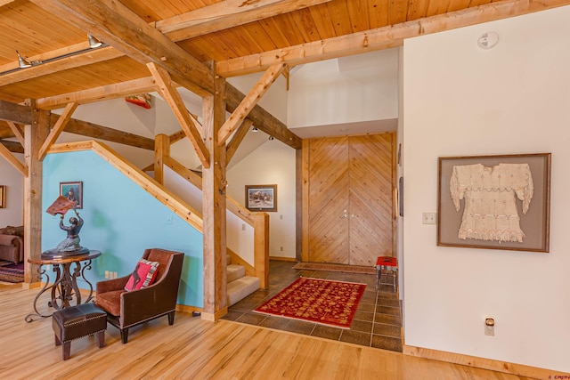 entrance foyer with dark hardwood / wood-style flooring and wooden ceiling