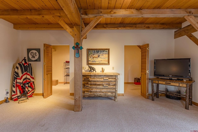 living room featuring light colored carpet, beamed ceiling, and wooden ceiling