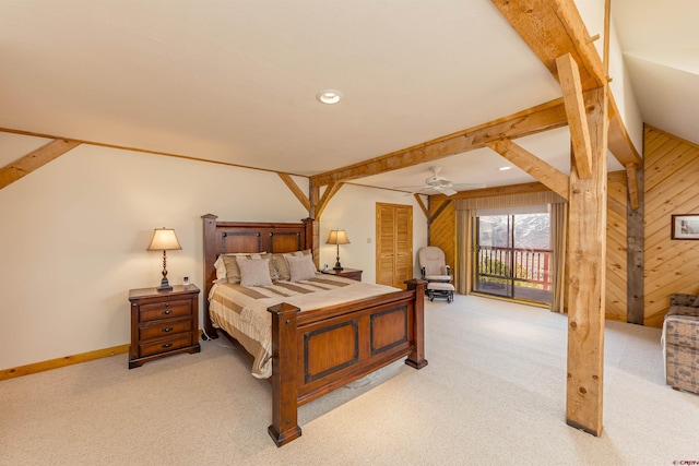 carpeted bedroom featuring wooden walls and lofted ceiling with beams