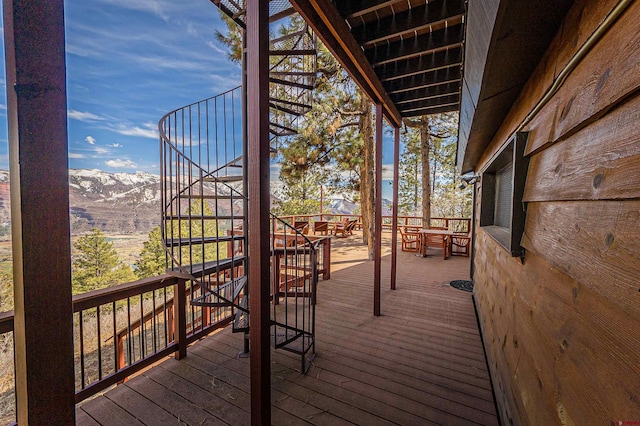 wooden deck with a mountain view