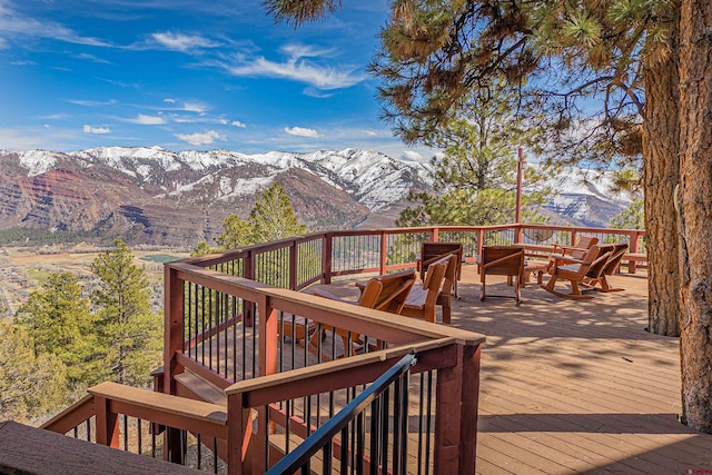 wooden terrace featuring a mountain view