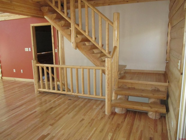 stairs with light wood-type flooring