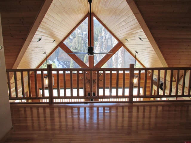 interior space featuring lofted ceiling, dark hardwood / wood-style floors, and wood ceiling