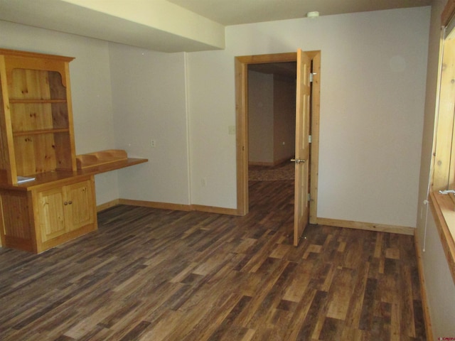 empty room with dark hardwood / wood-style floors