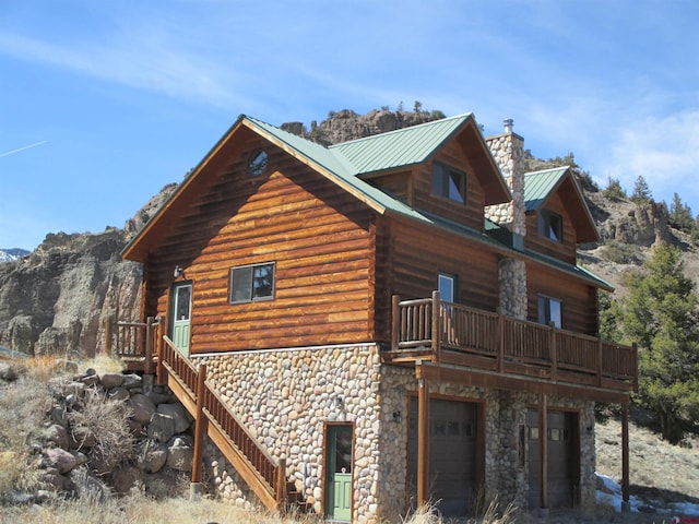 view of home's exterior featuring a mountain view and a garage