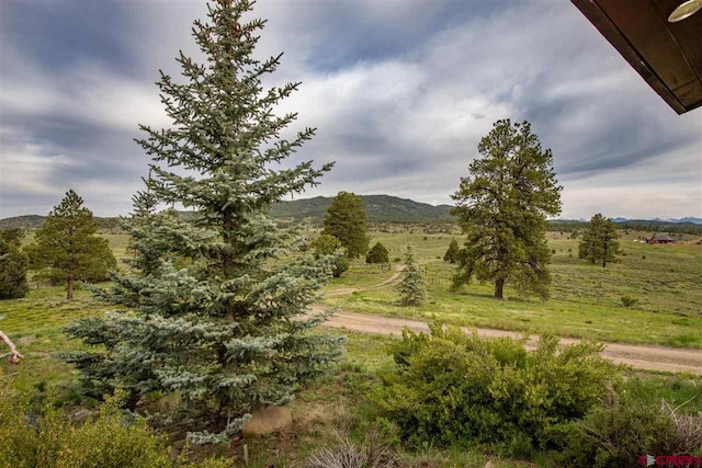 property view of mountains featuring a rural view