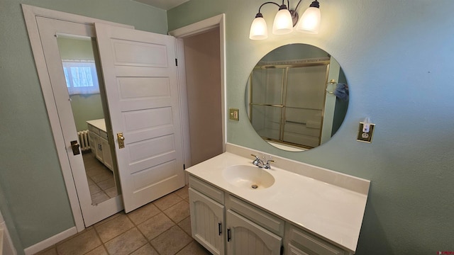 bathroom featuring tile patterned flooring and vanity