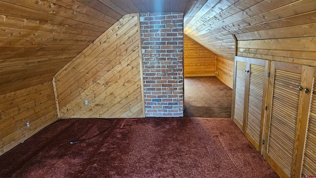 bonus room with dark colored carpet, wooden walls, vaulted ceiling, and wooden ceiling