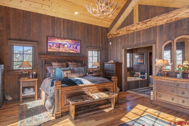 bedroom with wooden ceiling, high vaulted ceiling, wooden walls, light wood-type flooring, and beamed ceiling