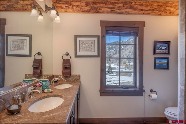 bathroom featuring vanity and toilet