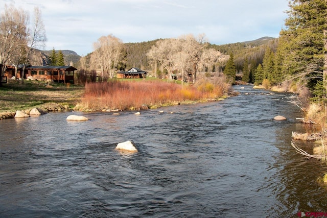 view of water feature featuring a mountain view and a gazebo