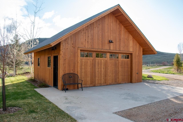 view of outbuilding featuring a garage