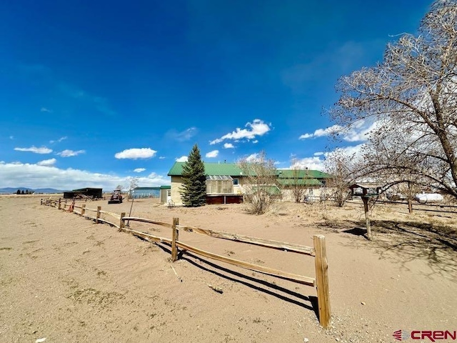 exterior space with a rural view