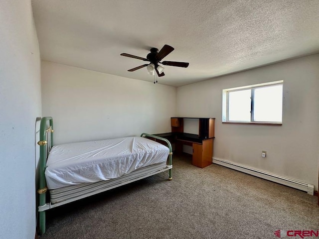 carpeted bedroom featuring a baseboard radiator, ceiling fan, and a textured ceiling