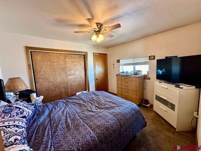 bedroom featuring ceiling fan and dark carpet