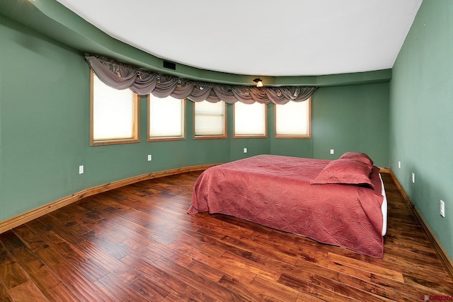 bedroom featuring dark hardwood / wood-style flooring