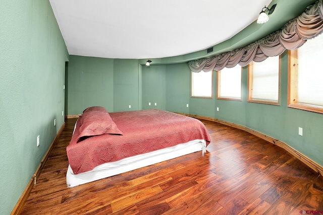 bedroom featuring dark hardwood / wood-style floors