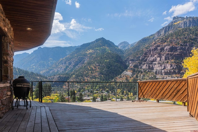 wooden deck with a mountain view
