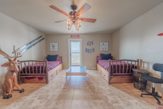 bedroom with ceiling fan and light tile floors