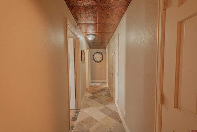 hallway featuring light tile floors