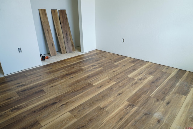 spare room with dark hardwood / wood-style flooring