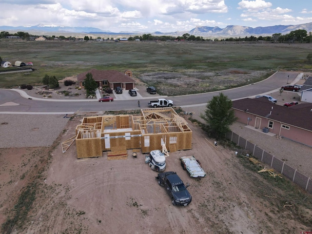 birds eye view of property with a mountain view