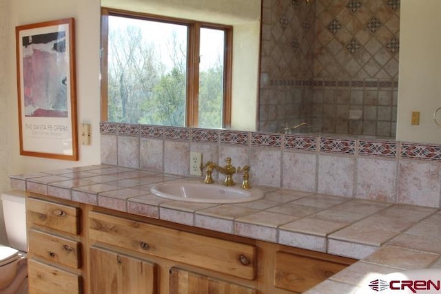 bathroom with toilet and vanity