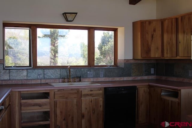 kitchen with sink, tasteful backsplash, plenty of natural light, and black dishwasher