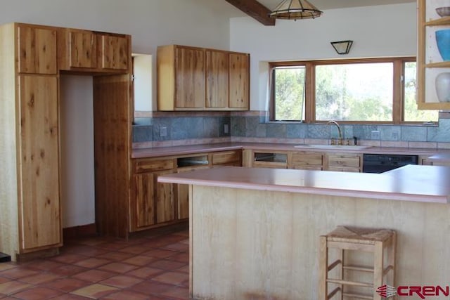 kitchen with black dishwasher, tile patterned flooring, kitchen peninsula, and sink