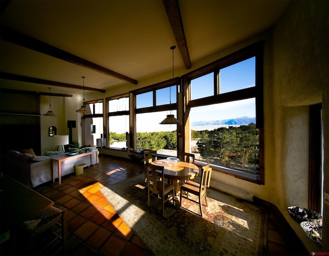 sunroom with beamed ceiling