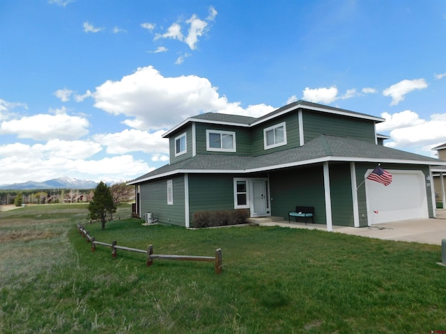 view of front facade featuring a garage and a front yard